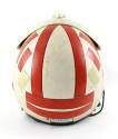 Rear view of helmet with orange and white reflective tape stripes applied over white background