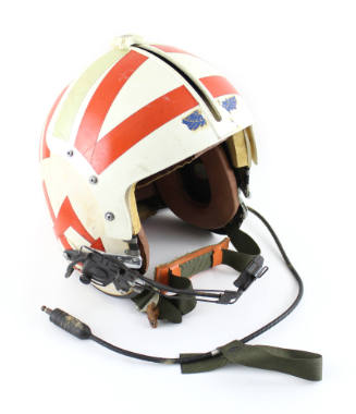 Helmet with attached intercom microphone and communication connection wire, white background wi…