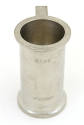 Tall silver souvenir cup with flared top and bottom rims, the words "Baby" and "Whisky" imprint…