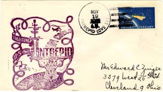 Envelope with purple stamp cover depicting USS Intrepid from the bow and inscriptions “Fighting…