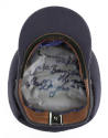 Interior of cap with three autographs written on silver lining with black marker