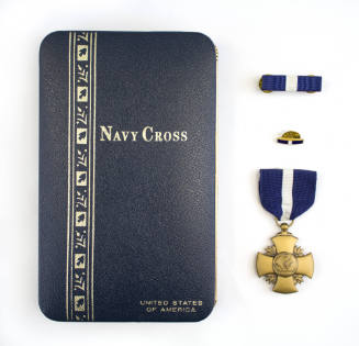 Navy Cross presentation box with ribbon bar, lapel pin and Navy Cross medal arranged vertically…