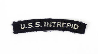 Dark blue U.S. Navy shoulder patch with "U.S.S. Intrepid" sewn in white