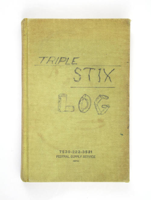 Green hardcover book with handwritten title "Triple Stix Log"