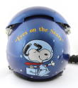 Rear view of blue NASA flight helmet with cartoon image of Snoopy as an astronaut, inscription …