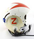 Side view of helmet with microphone and blue nob visible, the letter Z made from orange reflect…