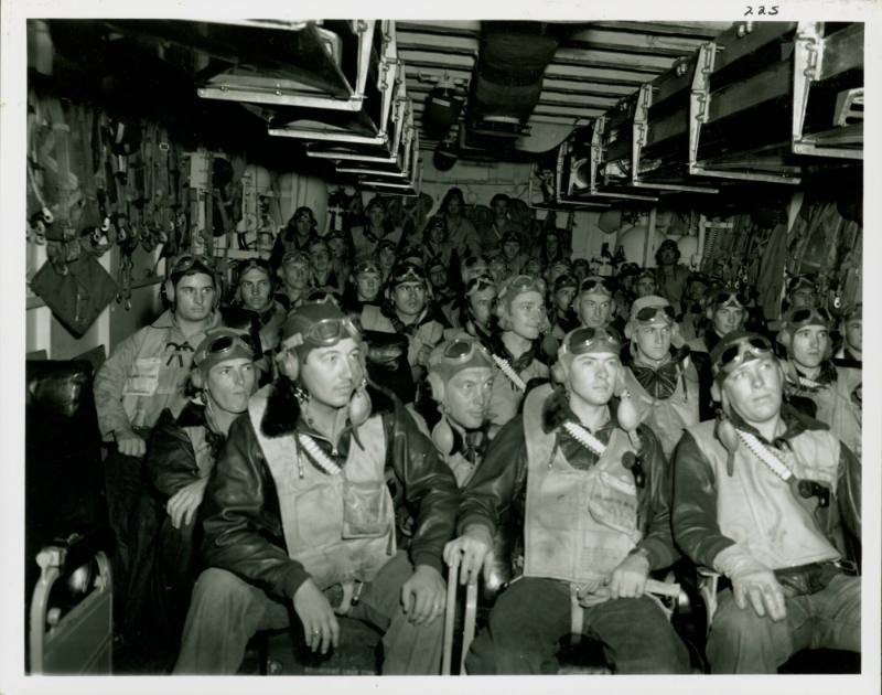 Black and white photograph of pilots seated in the ready room