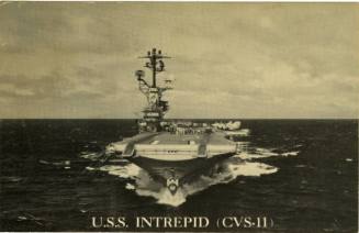 Black and white postcard with image of aircraft carrier at sea with text that reads “USS Intrep…