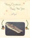Inside of "Greetings" card that has a color photograph of Intrepid at sea that reads "Merry Chr…