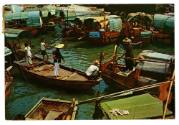Prined color postcard of a floating village in Aberdeen, Hong Kong