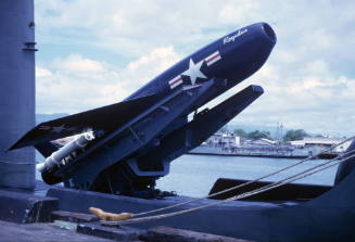 Color photograph of Regulus I missile mounted on a launcher on the topside of submarine USS Gro…