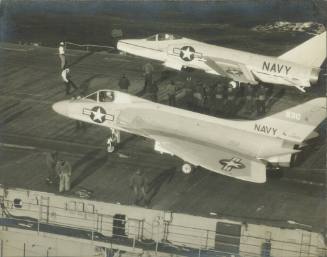 Black and white photograph of Douglas F4D-1 Skyray and Grumman F11F-1 Tiger on the flight deck