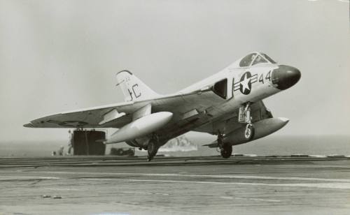 Black and white photograph of a Douglas F4D-1 Skyray landing on the flight deck