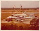 Color photograph of space shuttle Enterprise being removed from airplane