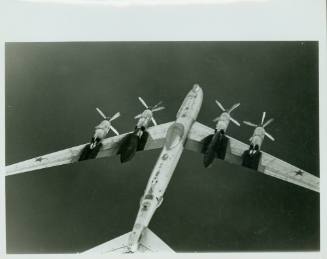 Black and white photograph of the underside of a TU-95