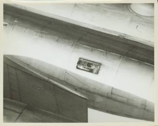 Black and white photograph of a missing maintenance door on a Russian M-4 Molot aircraft