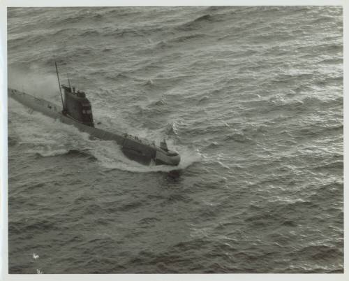 Black and white photograph of a Russian submarine breaking the surface of the water