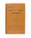 Orange hardcover book titled "Aviators Flight Log Book" with H.A. Repass written in the name fi…