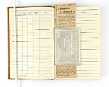 Interior of aviator flight log book open to show newspaper clipping and Imperial Domain of the …