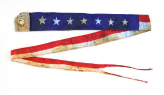 Long, streamer shaped U.S. Navy commissioning pennant with U.S. flag motif and forked tail end