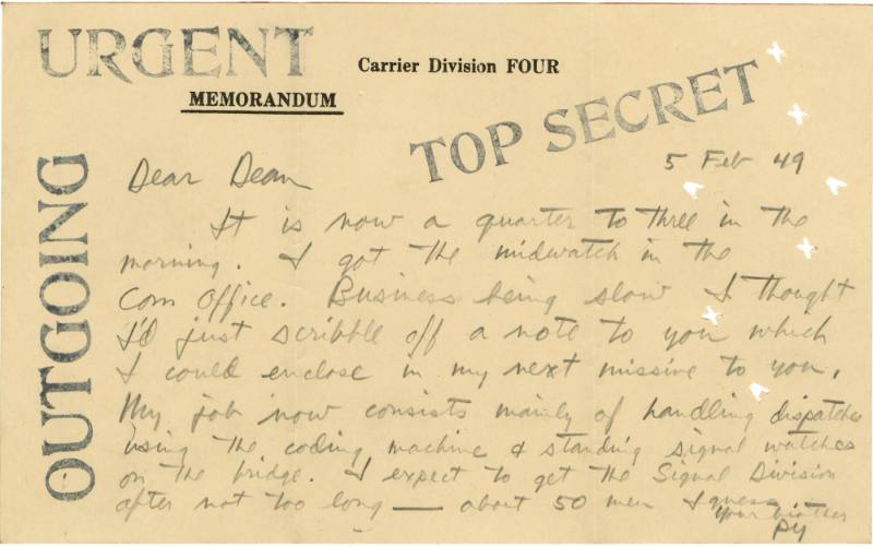Paper card with handwritten inscription and block letter stamps that read “Urgent, Top Secret, …