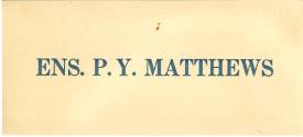 Printed sign that reads "Ens. P.Y. Matthews" in blue ink