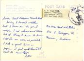 Address side of postcard with handwritten inscription in blue ink, title caption of front image…