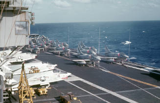 Color slide depicting aircraft on the flight deck with island visible on the left