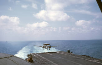 Color slide depicting an aircraft approaching the flight deck for landing