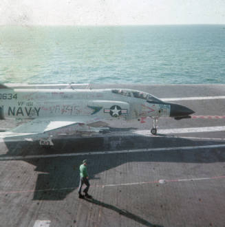 Color slide depicting an aircraft with grafitti on the flight deck