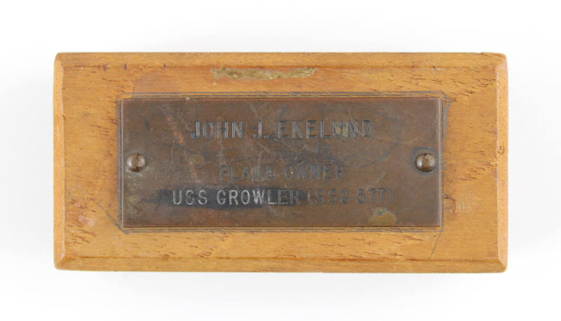 Plaque with engraved inscription, "John J. Ekelund Plank Owner USS Growler (SSG-577)," screwed …