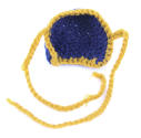 Inside of dark blue knit nose cover with gold ties attached at either side