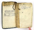 Open notebook with "John Edward Standish" handwritten inside the front cover