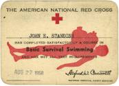 Printed card titled "Basic Survival Swimming" for John E. Standish dated August 22, 1958