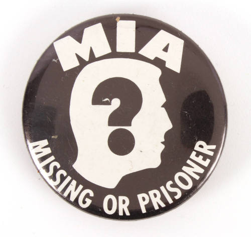 Political button with image of man’s head in profile with question mark in the center surrounde…