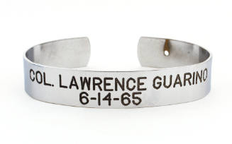 Silver bracelet with engraved inscription, "Col. Lawrence Guarino 6-14-65," on face, small open…