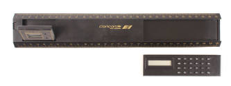 Black Concorde ruler with detached calculator and lifted clock attachment 