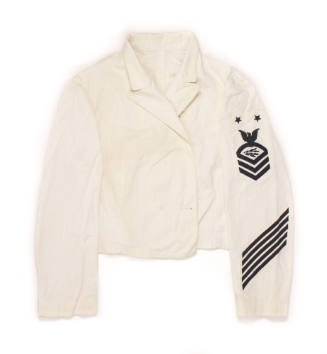 U.S. Navy white dress dinner jacket laid flat with rating patch and service stripes on left arm