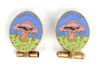 Two cufflinks with colored enamel USS Growler insignia image of a hand reaching out of water an…