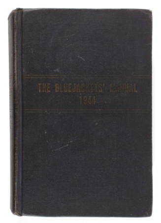 Black hardcover book with “The Bluejacket’s Manual 1944” inscribed in yellow in center