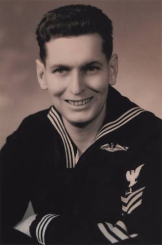 Black and white portrait of William D. “Ma” Irvin wearing dress blue jumper and submarine dolph…