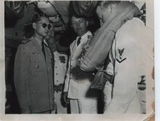 Black and white photograph of the King of Thailand on board the submarine USS Growler