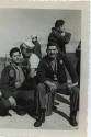 Black and white photograph of sailors in dungarees on a pier in Adak, Alaska