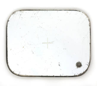 Rectangular mirror with rounded corners, a cross in the center, and a small hole in lower right…