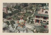 Color photograph looking down at a section of Tiger Balm Garden in Hong Kong, with a manicured …