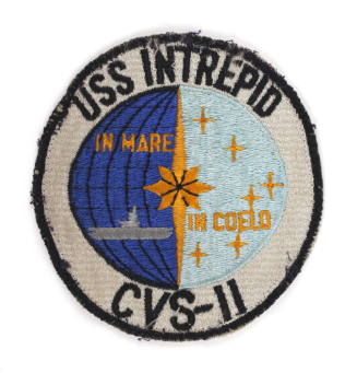 Embroidered USS Intrepid insignia patch, insignia shows aircraft carrier at sea bisected with s…