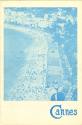 Booklet with a blue photograph of a coastline and "Cannes" in blue at the bottom