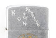 Lid of silver lighter with scratched inscription “Ron & Marilyn”