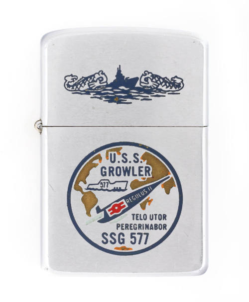 Silver lighter with an enameled USS Growler seal, which depicts the submarine Growler in the At…