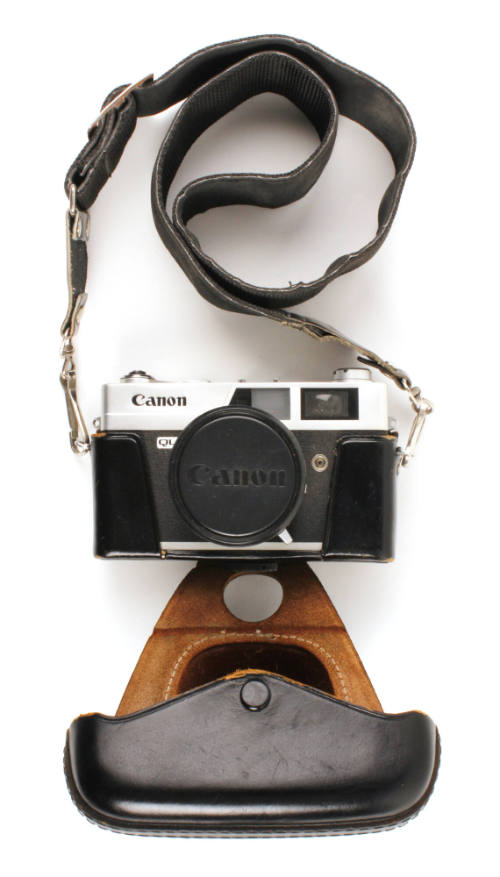 Canon Canonet QL17 camera in a black leather case with strap